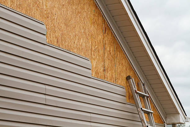 Professional Siding technician working in Needham Heights, MA